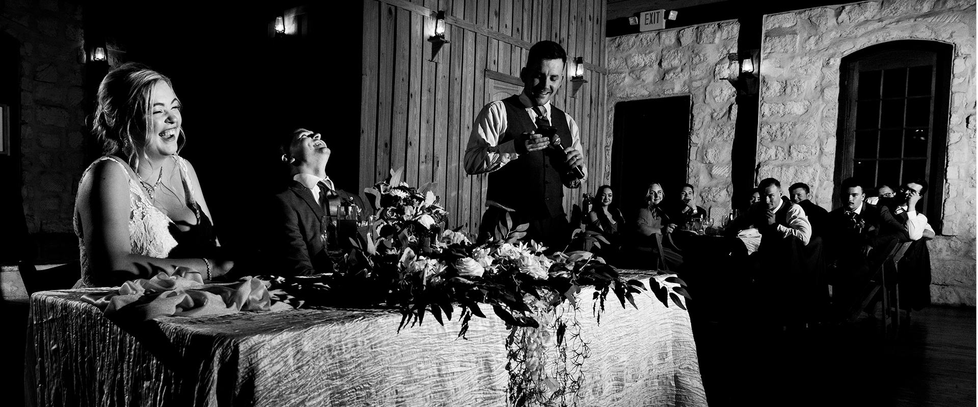 Bride & Groom laughing at the toast